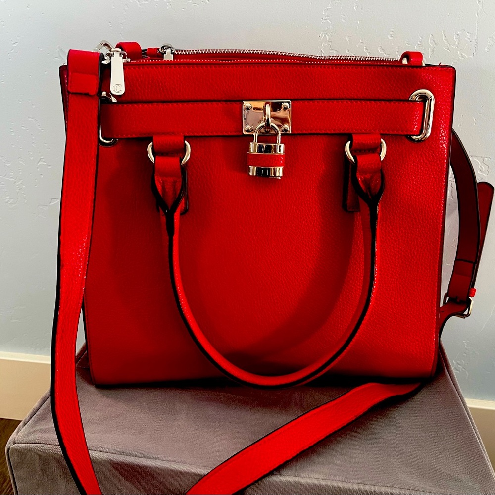 Red handbag with silver accents. 12x13x5 non-leather good condition